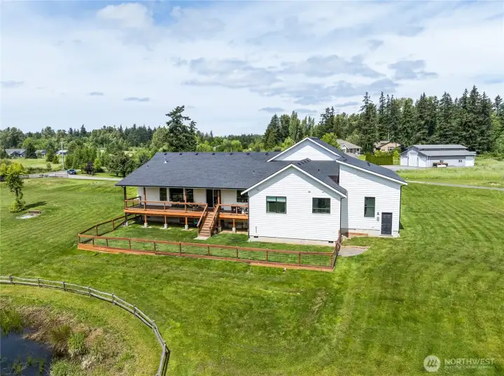 Perfectly maintained landscaping! Door to the far right is the back entrance to the attached RV garage/shop.