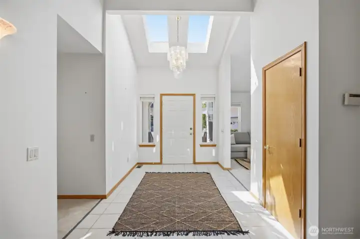The entry is well defined and light and bright! The floors are ceramic time and thee is a large coat closet.