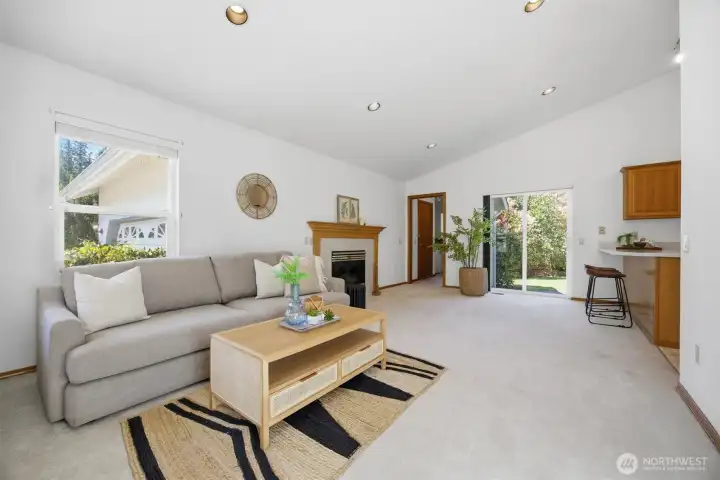 The family room is just off the kitchen and has a gas fireplace.