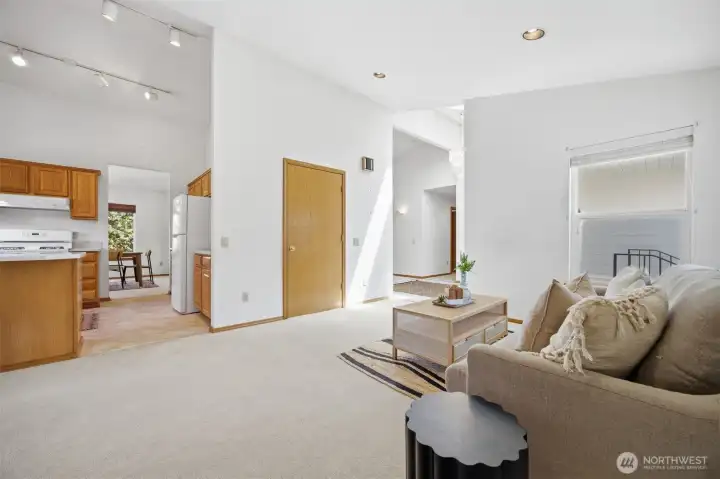 Looking from the family room toward the kitchen and the front entry.