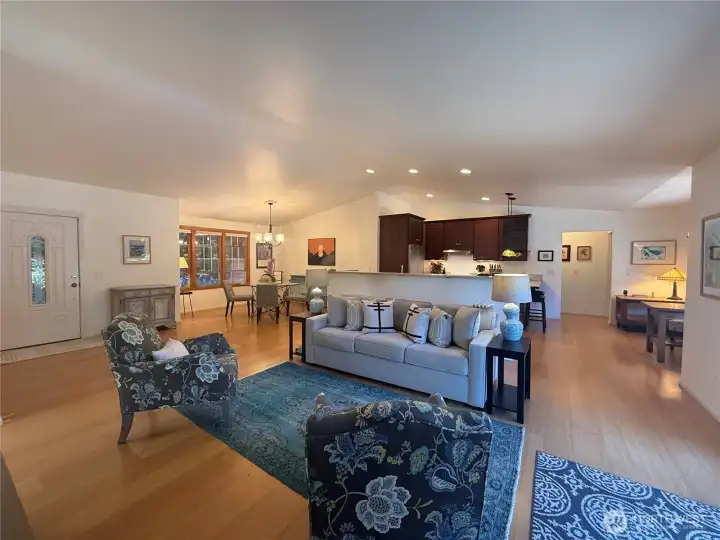 Beautifully appointed great room with vaulted ceilings, dining room and chef's kitchen with ample counter and prep space. Beautifully appointed great room with vaulted ceilings, dining room and chef's kitchen with ample counter and prep space.