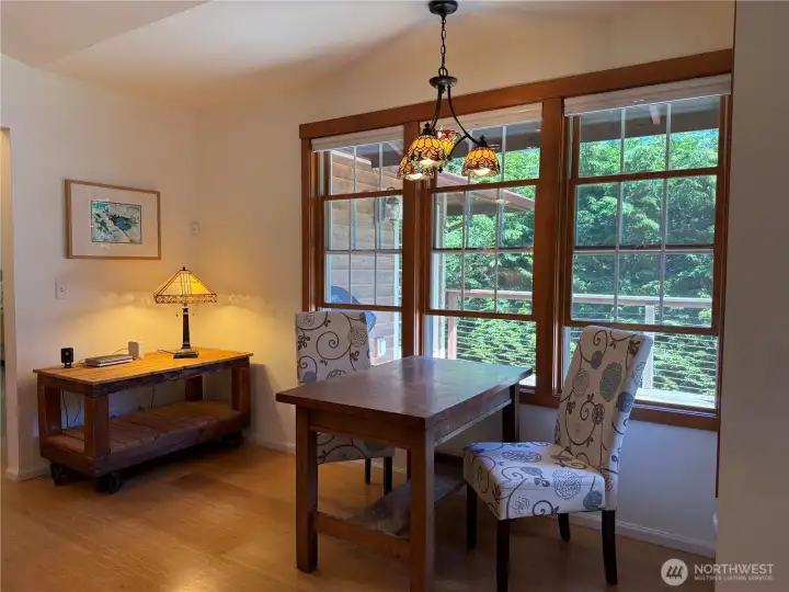 Beautiful wood-framed windows overlooking the deck and garden space and bringing abundant natural light into the home. Beautiful wood-framed windows overlooking the deck and garden space and bringing abundant natural light into the home.