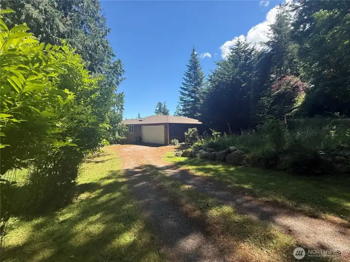 And from the exterior, an absolutely lovely single level home with both garage parking and driveway parking And from the exterior, an absolutely lovely single level home with both garage parking and driveway parking