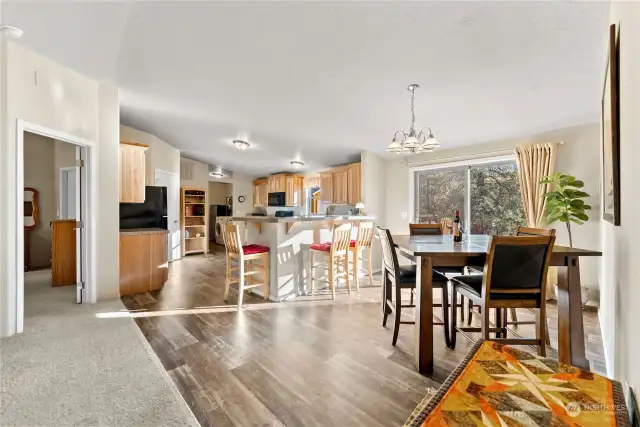 Kitchen is conveniently near sliding door to back deck for BBQ and gatherings in Summer. Dining room flows to breakfast counter with seating. Great space. Easy care vinyl plank floors.