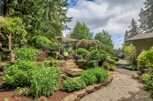 Terraced gardens great you as you approach the front door. Filled with stunning northwest plantings, a patio with an arbor for chilling and a fabulous fountain....it is simply beautiful!