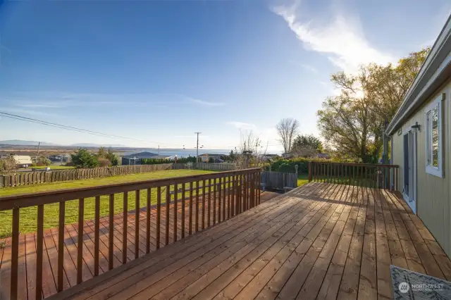 The cedar deck was recently replaced and it is expansive. There is a pad and electrical for a hot tub where the deck ends.