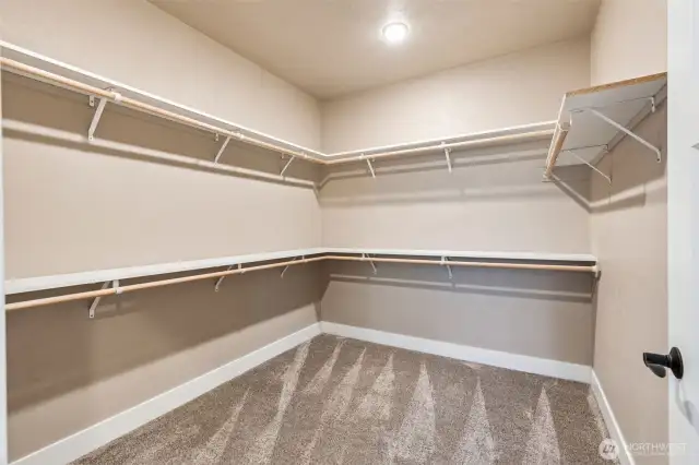 Primary bedroom extra-large walk-in closet.
