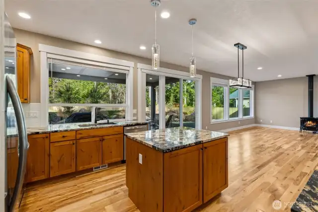 Granite countertops, shaker style cabinetry.