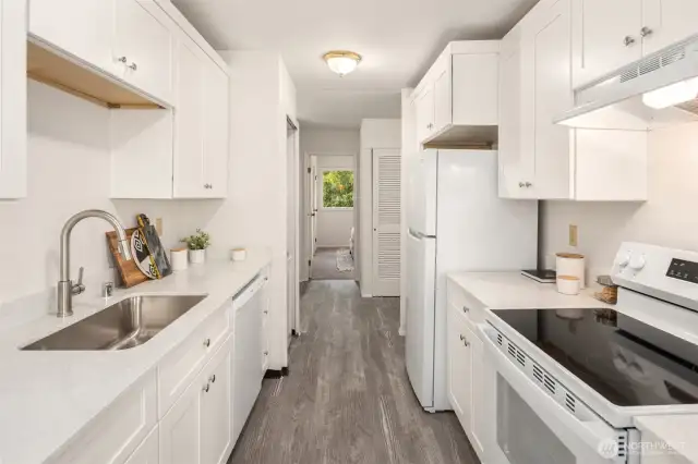 Brand new kitchen with new dishwasher, countertops, sink, faucet, garbage disposal