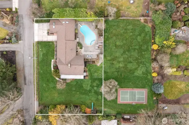 Property for sale does not include vacant lot directly to the east. The fence behind the pool (and extending that fence line to the south side of the yard) is the approximate lot line.