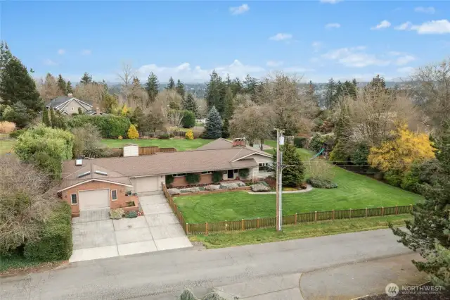 Property for sale does not include vacant lot directly to the east. The fence behind the pool (and extending that fence line to the south side of the yard) is the approximate lot line.