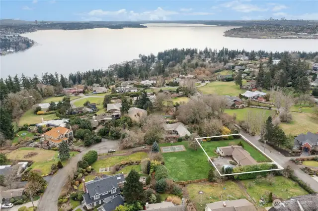 Property for sale does not include vacant lot directly to the east. The fence behind the pool (and extending that fence line to the south side of the yard) is the approximate lot line.