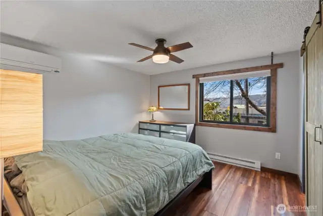 The primary bedroom has a half bath and walk in closet ... not to mention gorgeous mountain views!