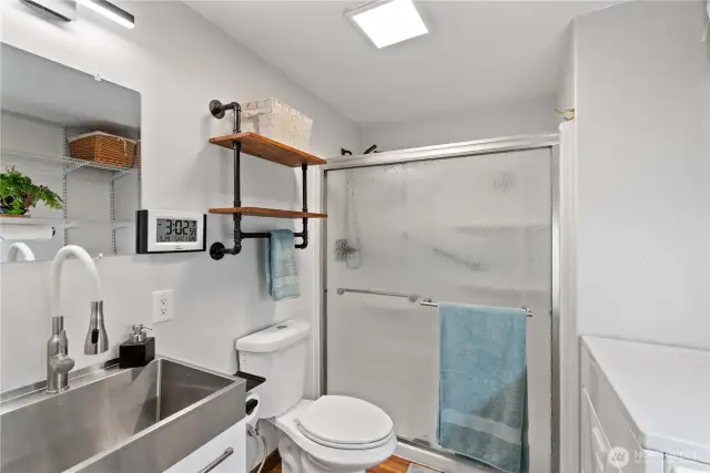 The full bath has a walk in shower and a stainless steel sink with flexible faucet to meet all of your washing needs.