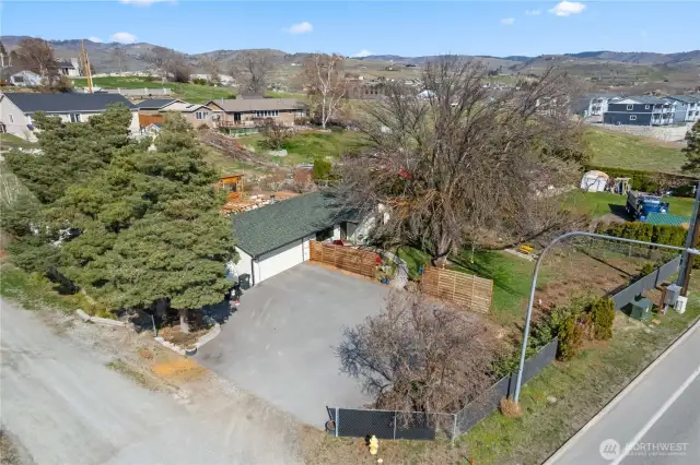 This property is completely fenced in the back and nearly completely fenced in the front. Just link the new fence on the south side to the existing fence on the west side (by the evergreen tree).