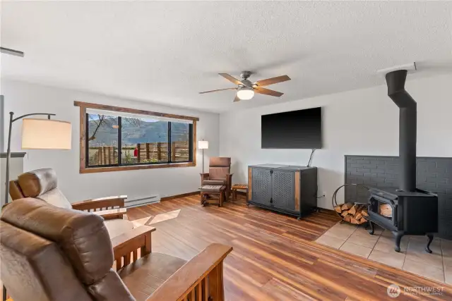 There is new LVP flooring throughout the home, and a certified wood burning stove for cozy living.