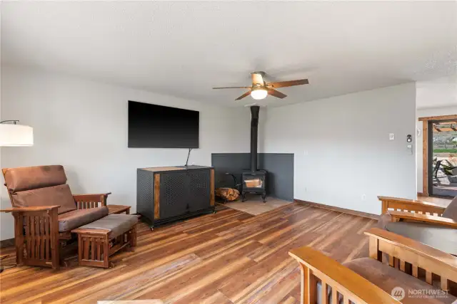 An inviting flow from the living area and the big slider door draws you to the dining and kitchen areas.