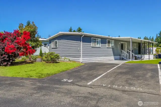 One covered parking spot under carport, and assigned spot in front of house.