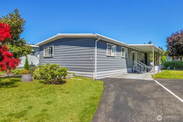 One covered parking spot under carport, and assigned spot in front of house.