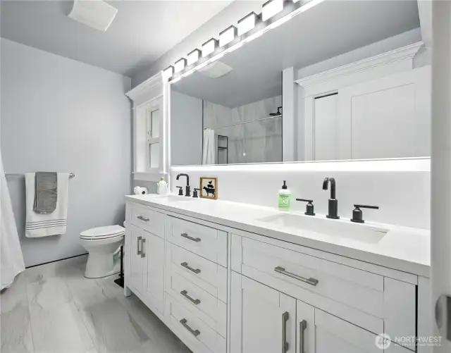 Double vanity w/quarts counters & in cabinet plugs