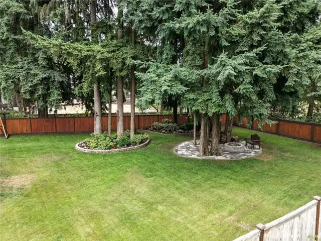 Beautiful landscaped backyard with greenbelt on 1 side