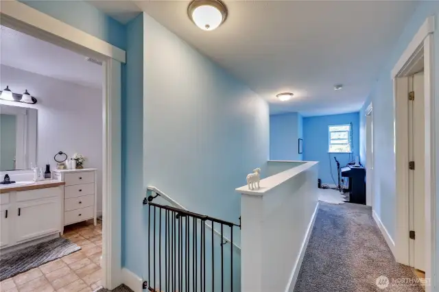 Full bath on the left, and upstairs hallway to bedrooms and flex space