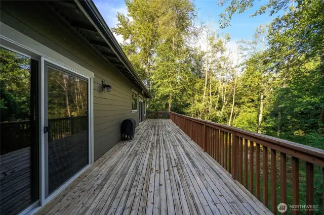 Sliding glass door in foreground leads to primary bedroom.