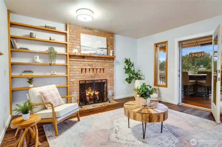 Beautiful living spaces including a wood burning fireplace for cozy nights! Sliders take you to your waterfront oasis!