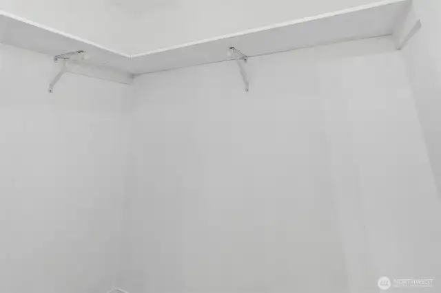 Walk-in closet offering excellent storage in the primary suite—ready for custom organizers or simple shelf-and-rod efficiency to keep everyday essentials within easy reach.