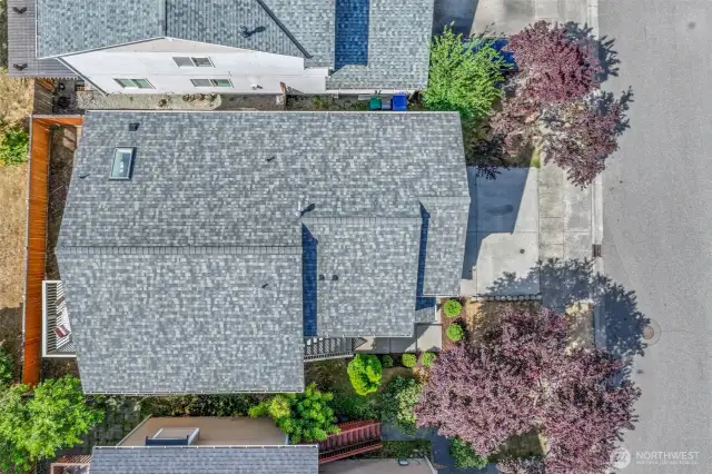 Roof and lot overview emphasizing the 2023 architectural roof, skylight over the kitchen, and the efficient footprint of the 3,200 SF parcel. The neighborhood setting delivers easy Bothell access for commuting, shopping, and parks.