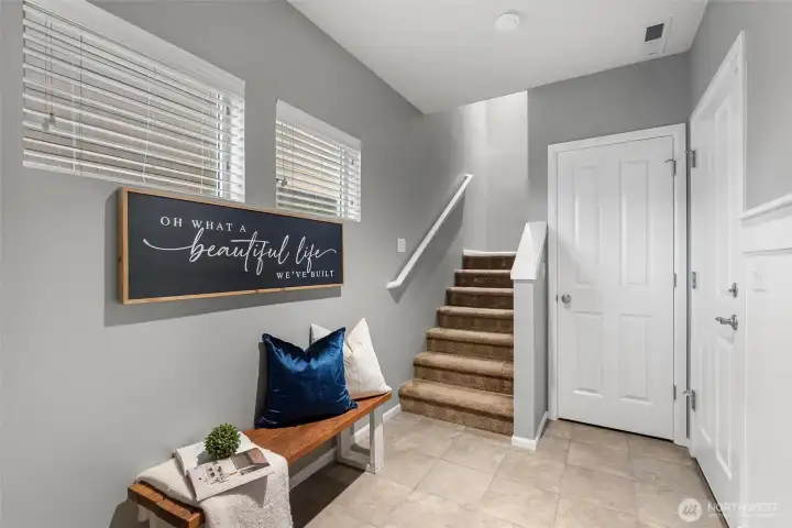 Your entry is roomy with a large closet and right off the garage.