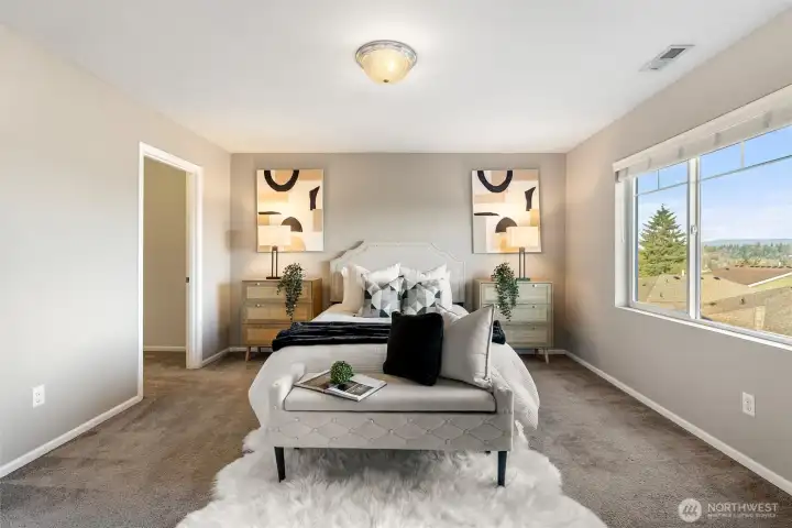 Primary suite with a view of the lake.