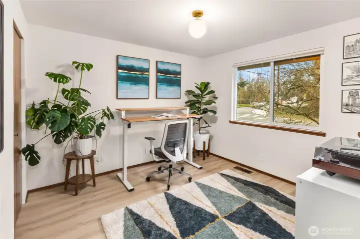 A main floor bedroom that is currently being used as a spacious work-from-home office.