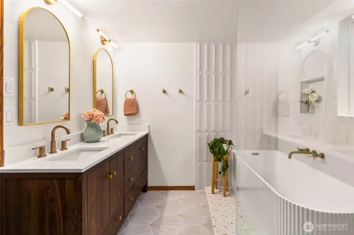 The bathroom on the upper floor was entirely remodeled in 2025 with radiant floor heating and boutique fixtures and fittings.