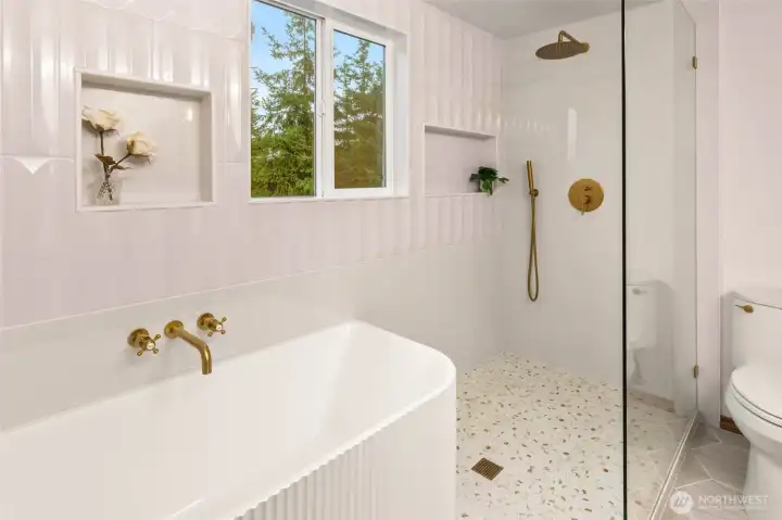A large soaking tub and separate shower offer wow factor in this 5 piece bathroom.
