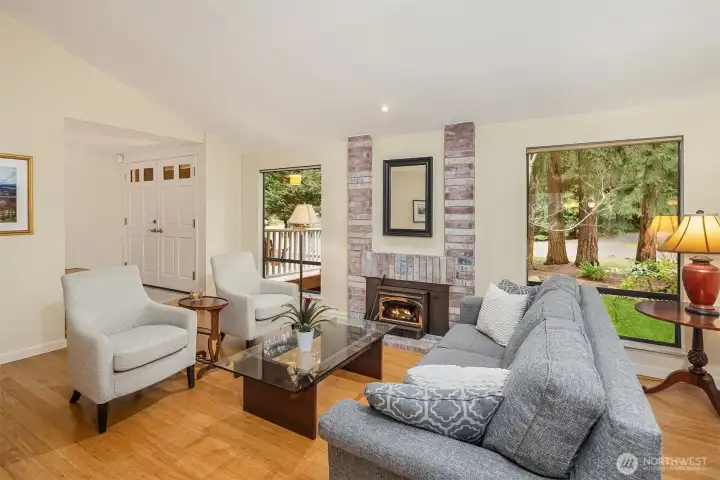 Gather around the fireside in the vaulted living room.