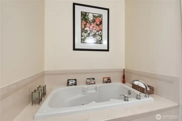 Primary ensuite with tub, dual vanity, shower/powder room.