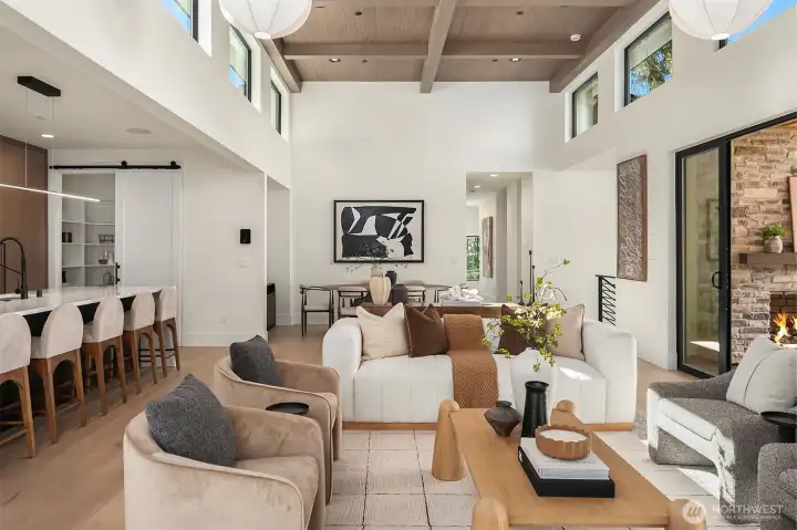 Soaring 14-foot exposed beam and tongue-and-groove ceilings create an airy, architectural statement.