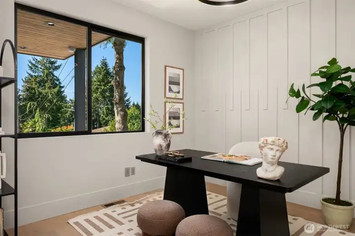 Main-level office easily doubles as a fourth bedroom, offering flexibility for work or guests.