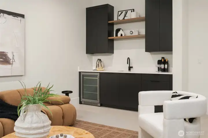 Spacious bonus room with wet bar and a private door for sound control — perfect for movie nights, game days, and late-night entertaining.