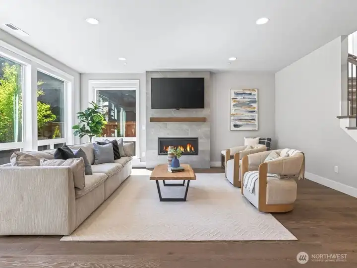 The great room features walls of windows that provide an abundance of natural light.