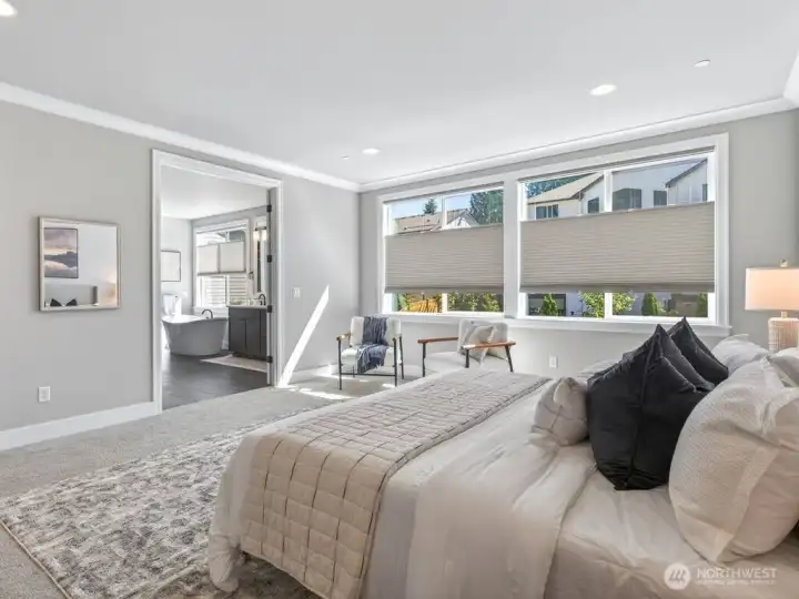 The luxurious primary suite offers peace and quiet to rejuvenate.