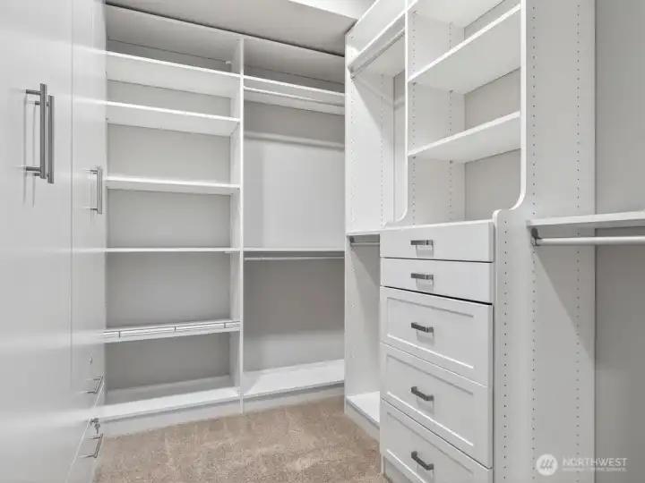 An amazing added amenity, the sought-after his and her primary suite walk-in closets.