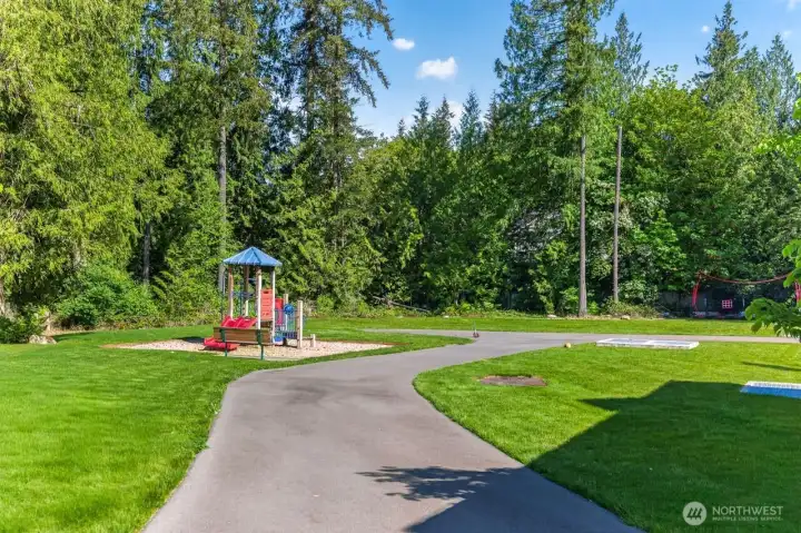 The home is located just steps from this fun community park.