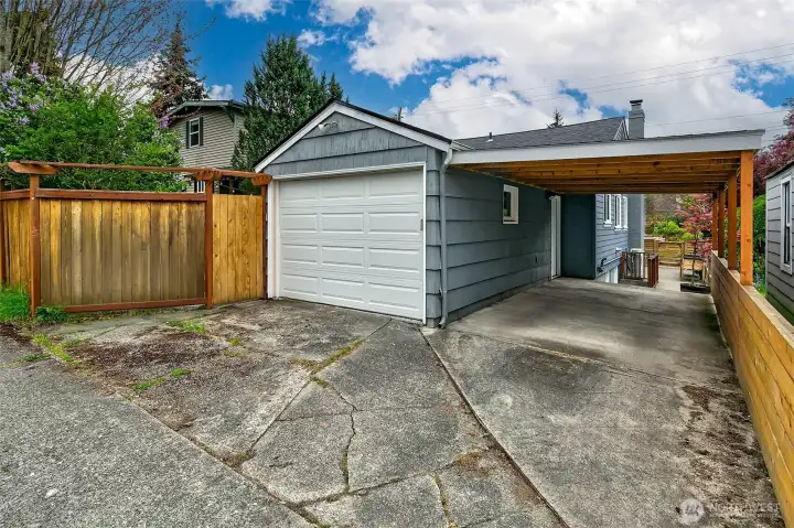 Attached garage and covered carport, accessible from the alley.