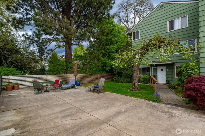 This end unit is right off a large sun deck, and even has a bit of yard space as well.