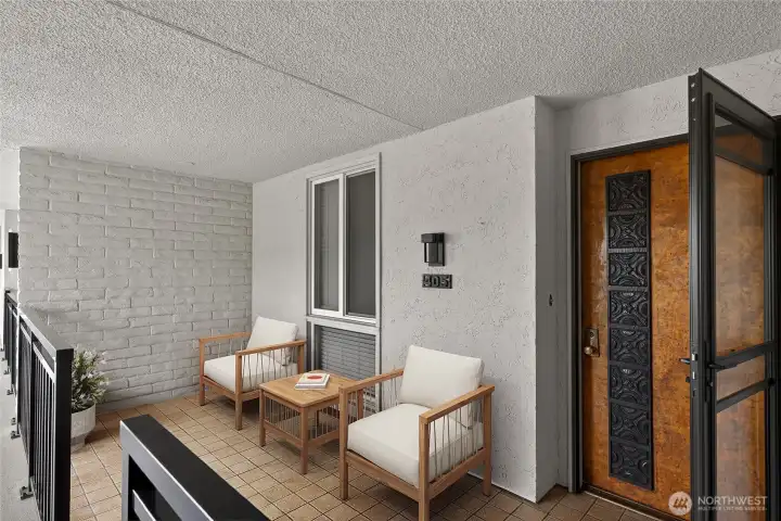 Staged-Welcoming covered entry w/patio. Short distance from elevator.