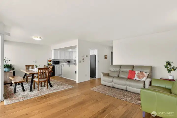 Beautiful manufactured hardwood floors throughout the living, dining and hall.