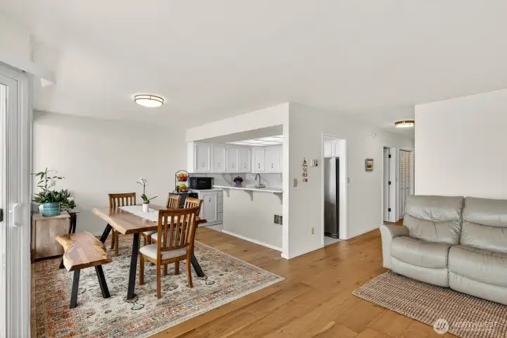 Beautiful manufactured hardwood floors throughout the living, dining and hall.