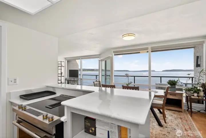 Beautifully updated kitchen with new stainless appliances and Qaurtz countertops and backsplash.